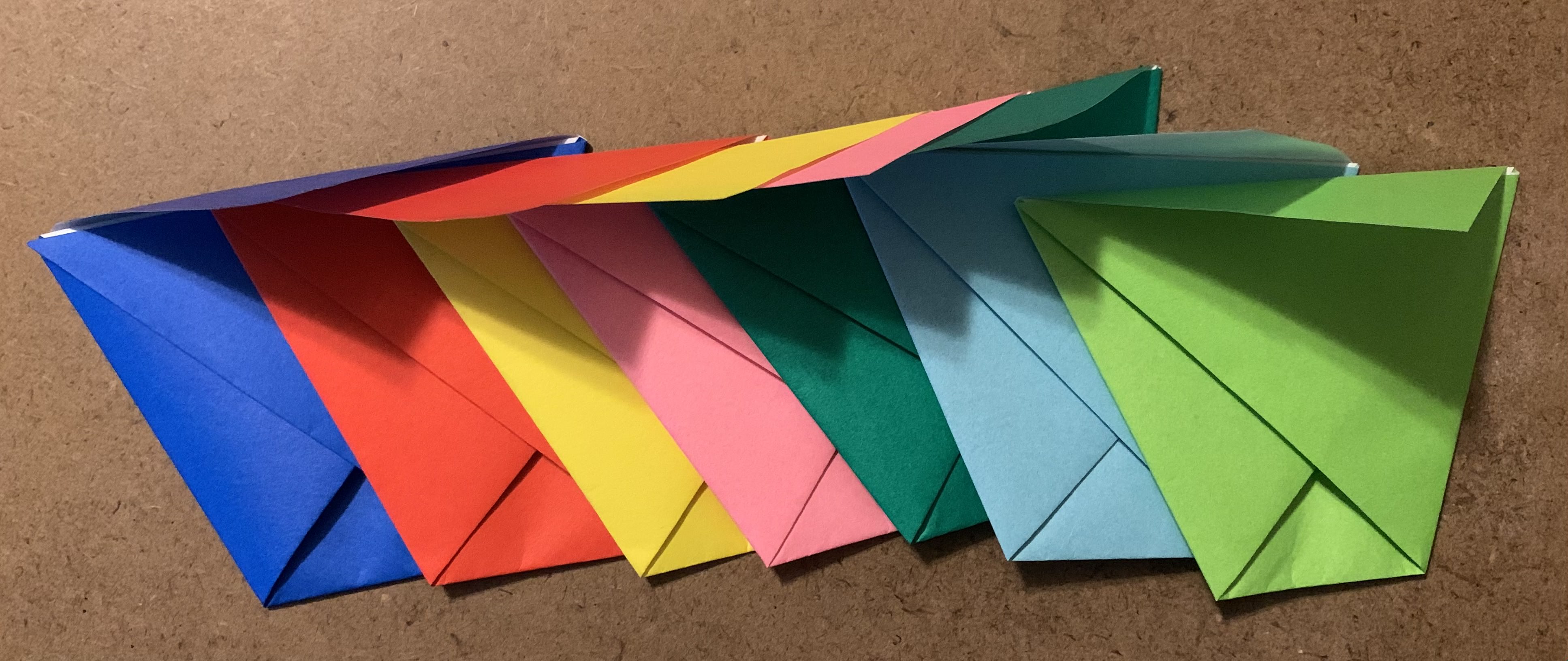 stack of completed origami envelopes